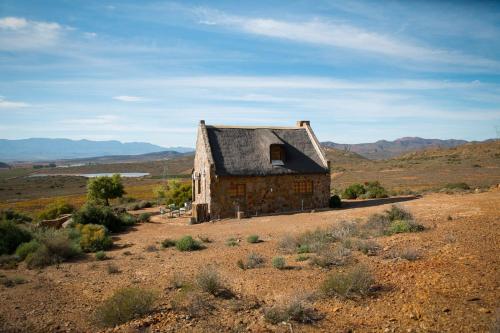 an old building in the middle of the desert at Fossil Hills in McGregor