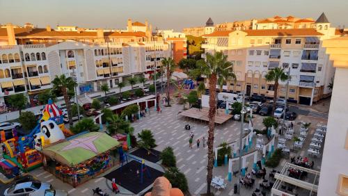 an overhead view of a city with a amusement park at Vivienda Turística Playa El Portil in El Portil