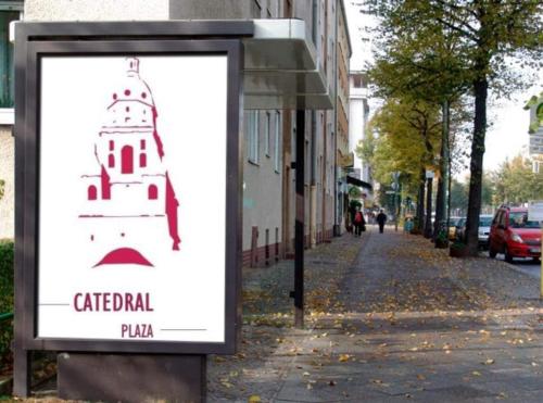 a sign with a lighthouse on a city street at Catedral Plaza in Murcia