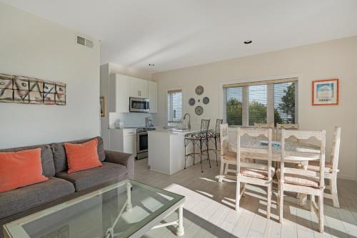 a living room with a couch and a table at The Hermitage at Napeague in Amagansett