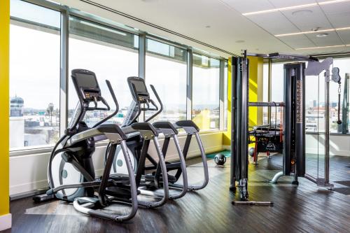 a gym with treadmills and elliptical machines at Hotel Indigo Los Angeles Downtown in Los Angeles