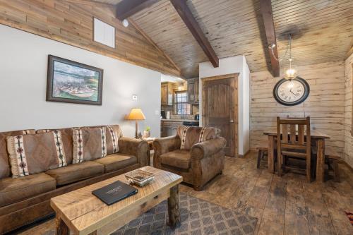 a living room with a couch and a table at Table Rock Resorts at Indian Point in Branson