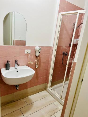 a bathroom with a sink and a shower at Le Maschere in Mestre