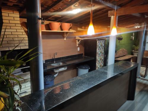 a kitchen with a counter and a sink at CASAMAR Lucena in Lucena