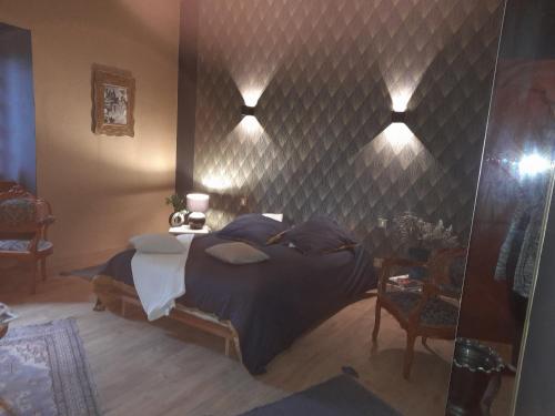 Postel nebo postele na pokoji v ubytování chambre du jura