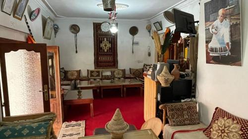 a living room with a couch and a table at Guesthouse Panorama Todra in Tinerhir