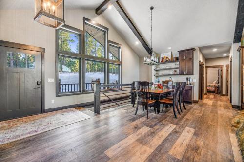 a dining room and kitchen with a table and chairs at Pillar Peak Perch in Sturgis