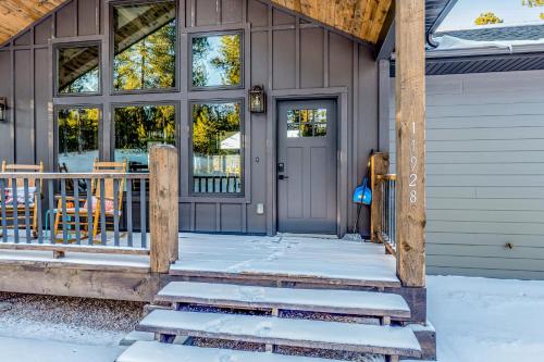 a front door of a house with snow on the porch at Pillar Peak Perch in Sturgis