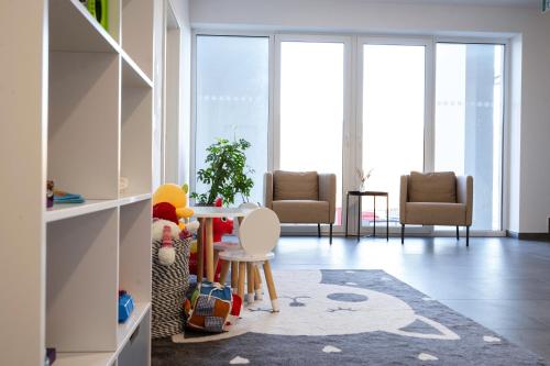 a living room with a table and chairs at Apartmán 101 Vila Zuberec in Zuberec