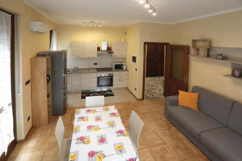 a living room with a couch and a table at Langhe Apartament in Monforte dʼAlba