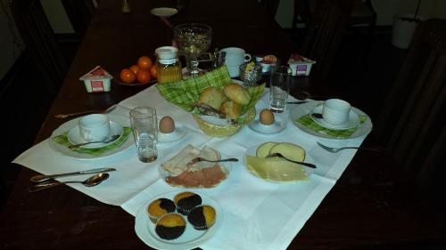 a table with eggs and other food on it at Hotel Bad Langensalza Eichenhof in Bad Langensalza