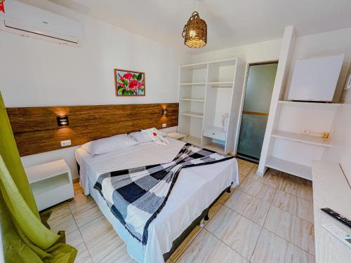 a bedroom with a bed in a room at Mar a Vista in Porto De Galinhas