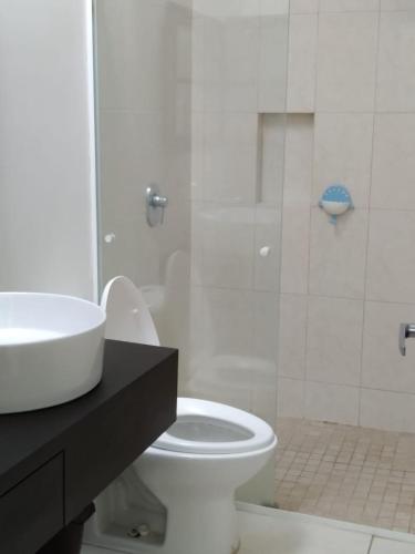 a bathroom with a sink and a toilet and a shower at CASA CERRITOS MAZATLAN in Mazatlán