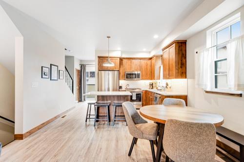 a kitchen and dining room with a table and chairs at Silverpine Retreat in McCall