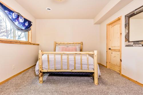 a bedroom with a bed and a window at A Place To Gather in Tomahawk