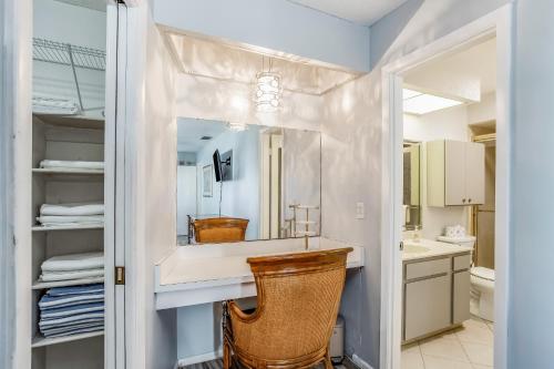 a bathroom with a sink and a mirror at Norma on the Canal in Punta Gorda