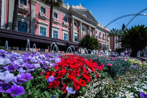 a garden of flowers in front of a building at Catedral Plaza in Murcia