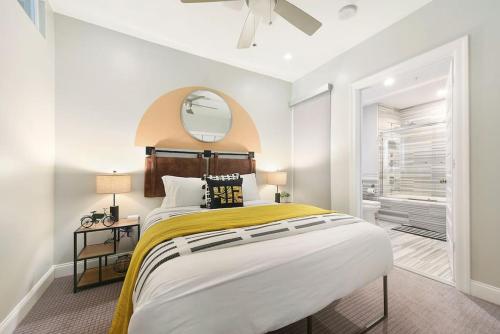 a bedroom with a large bed and a mirror at HostWise Stays - The Washington at Chatham - Free Parking, Fitness Center in Pittsburgh