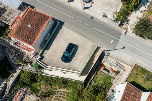 an overhead view of a car parked next to a building at Green Paradise in Mlini