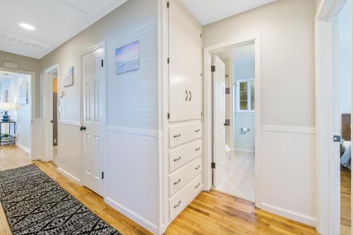 a bedroom with white walls and a large closet at Cozy Oak in Arroyo Grande