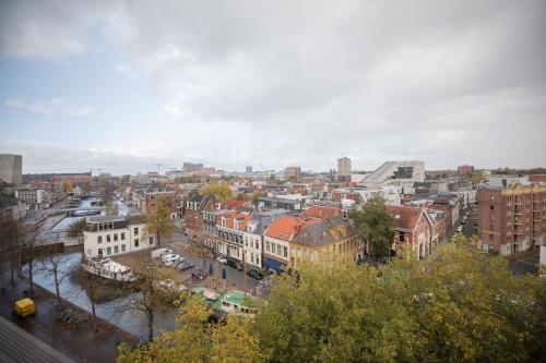 a view of a city with buildings and trees at Flonk Hotel Groningen Centre, BW Signature Collection in Groningen