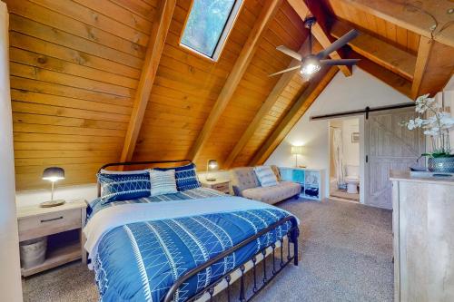 a bedroom with a bed and a wooden ceiling at The Retreat on Wabash Lane in Lake Arrowhead