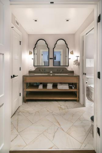a bathroom with a vanity and a mirror at Homestead Resort in Midway