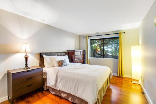 a bedroom with a large bed and a window at Sunset Getaway in Utsalady