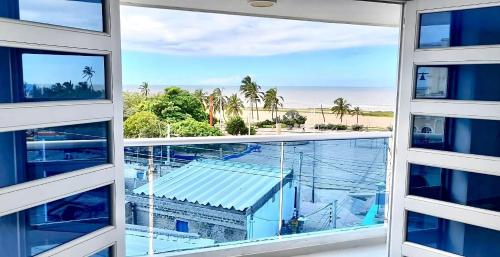 a view of the beach from the balcony of a building at Balcones al Mar by La Marina in Ríohacha