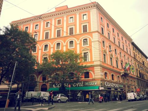 a large building on the corner of a city street at Ottaviano Guest House in Rome