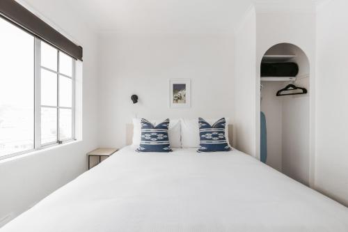 Ένα ή περισσότερα κρεβάτια σε δωμάτιο στο The Mission Belle Motel