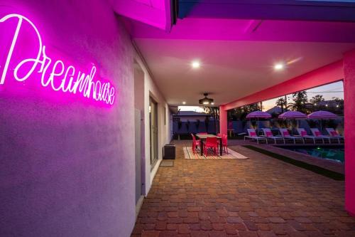a pink neon sign on the side of a building at Scottsdoll Dreamhouse Walk to Old Town NEW in Scottsdale