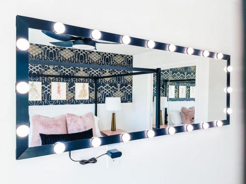 a large mirror with lights on a room at Scottsdoll Dreamhouse Walk to Old Town NEW in Scottsdale