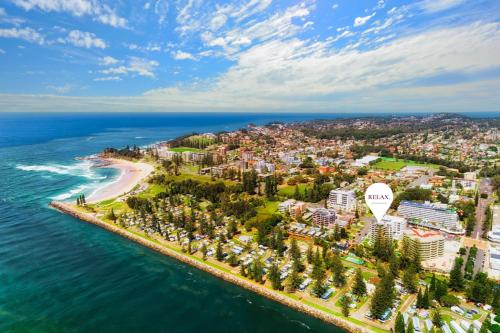 an aerial view of a city and the ocean at Tasman 15 in Port Macquarie