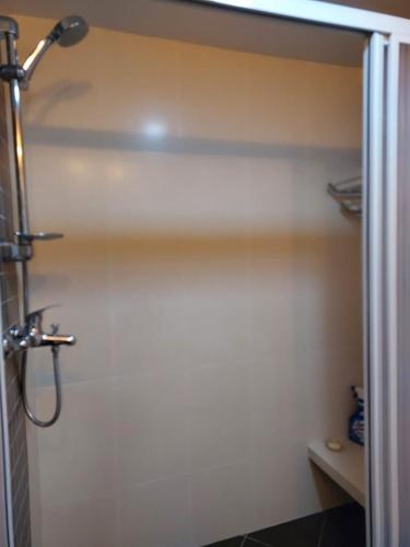 a bathroom with a shower stall with a shower at Batu Ferringhi Luxury Seaview Suite - 3Br in Batu Ferringhi