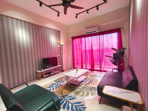 a living room with a couch and a tv at Pavilionvillie M1T570 by irainbow in Ipoh