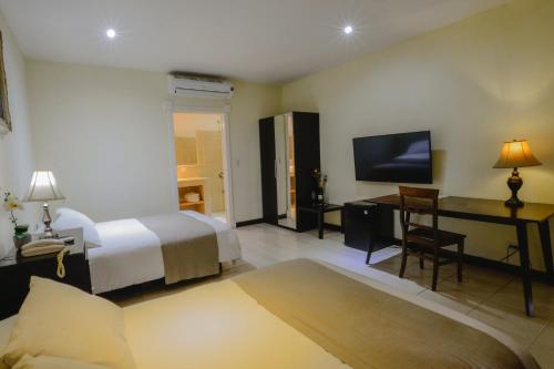 Postel nebo postele na pokoji v ubytování Hotel Luisiana