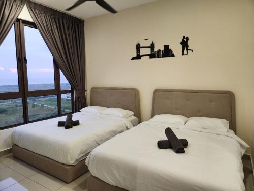 Postelja oz. postelje v sobi nastanitve Melaka Sea View Bali Residence