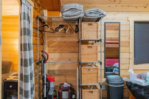 a room with two bunk beds and baskets at 1 Bd Deluxe Log Cabin View Northern Lights in Fairbanks