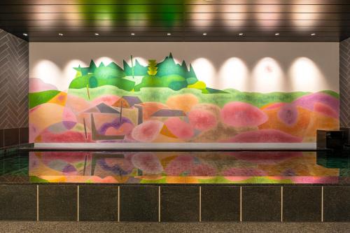 a display case with avertisement for at Mito Sannomaru Hotel in Mito