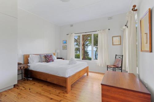 Postel nebo postele na pokoji v ubytování Elizabeth Cottage, Jervis Bay