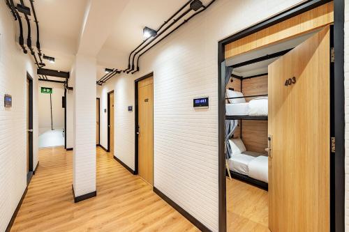 a corridor of a hospital with two bunk beds at Siam Subway Hostel and Café in Bangkok