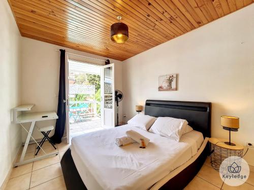 Voodi või voodid majutusasutuse Paul et Aliette - T3 classé 3 étoiles - 70m2 - Saint-Denis toas