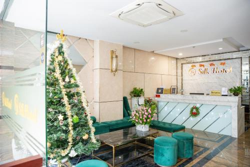 a christmas tree in the lobby of a salon at Silk Hotel near Tan Son Nhat Airport in Ho Chi Minh City