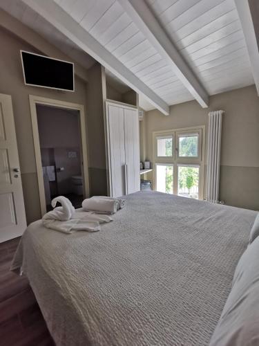 Postel nebo postele na pokoji v ubytování Agriturismo e Acetaia la Vedetta