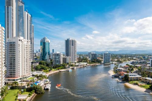 a river in a city with tall buildings at Condor Apartments by Gold Coast Premium in Gold Coast