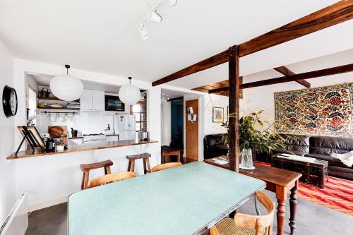 a kitchen and living room with a table and chairs at Tarndwarncoort Homestead in Warncoort