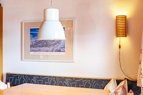 a dining room with a table and a light at Haus Excelsior Top 13 in Seefeld in Tirol
