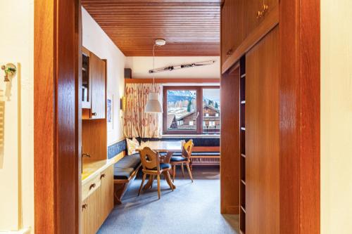 a kitchen and dining room with a table and chairs at Haus Excelsior Top 13 in Seefeld in Tirol