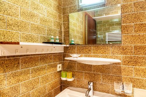 a bathroom with a sink and a mirror at Haus Excelsior Top 13 in Seefeld in Tirol